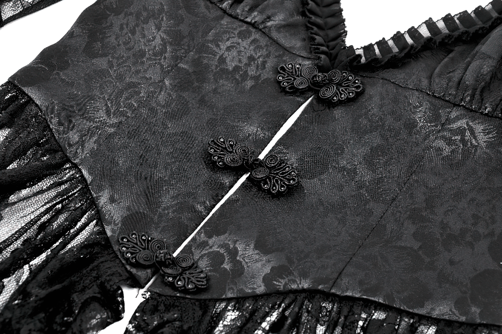 Elegant black lace cape with intricately designed buttons and ruffled sleeves, perfect for gothic and alternative fashion.