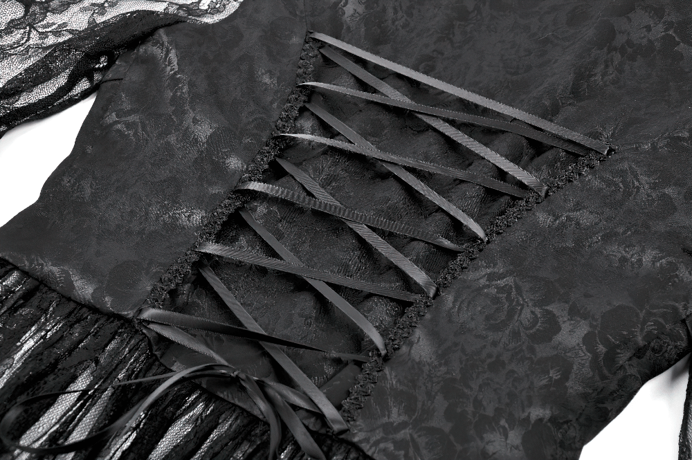 Close-up of gothic lace cape showcasing intricate lace detailing and stylish lace-up back design.