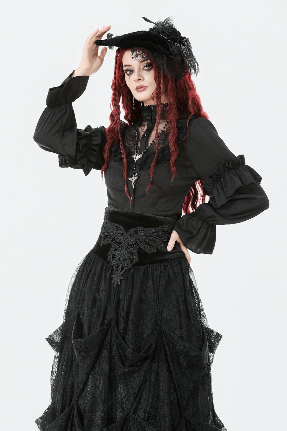 Gothic Lace Ruffle Black Blouse with Button Closure showcased on a model, featuring dramatic ruffles and lace accents.