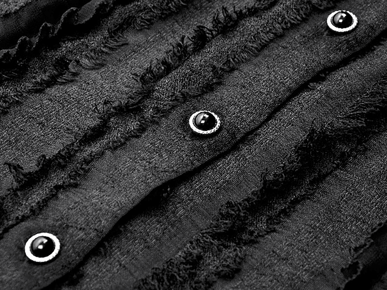 Close-up of buttons and textured ruffles on the Gothic Lace Ruffle Long Sleeve Shirt with Button Closure.