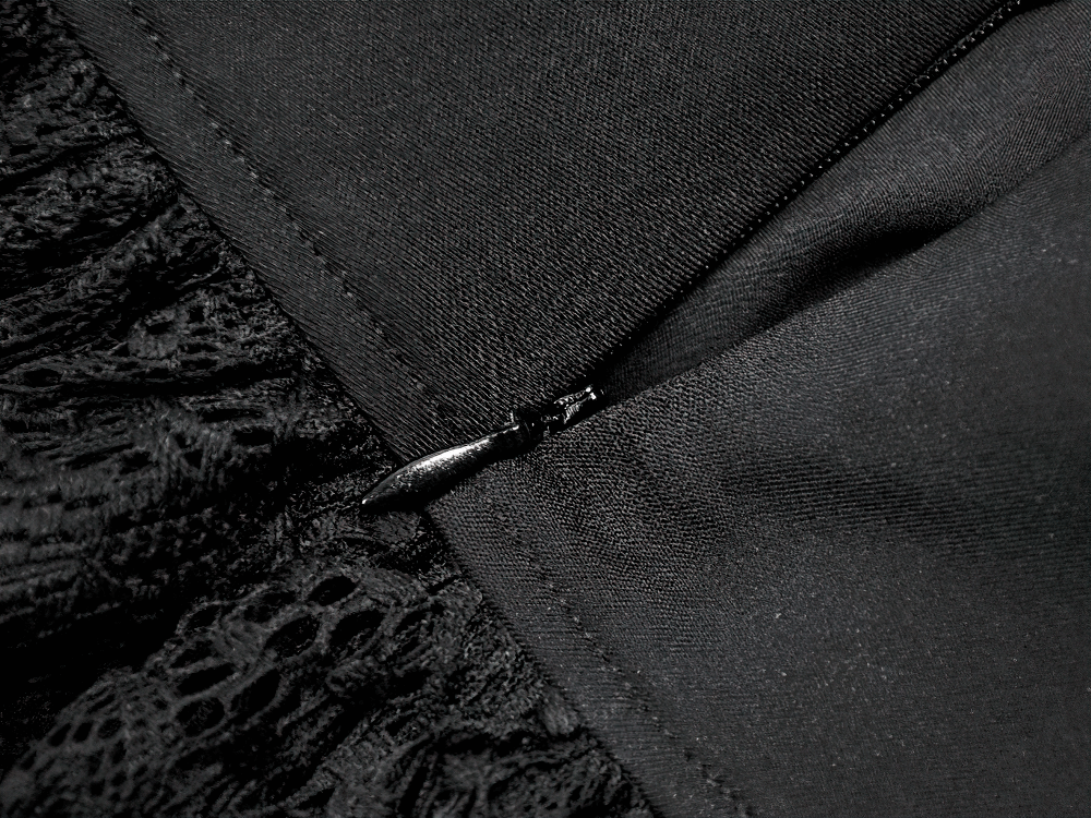 Gothic Lace Ruffle Mini Skirt with Buckle Straps zipper detail showcasing layered lace and smocked fabric.