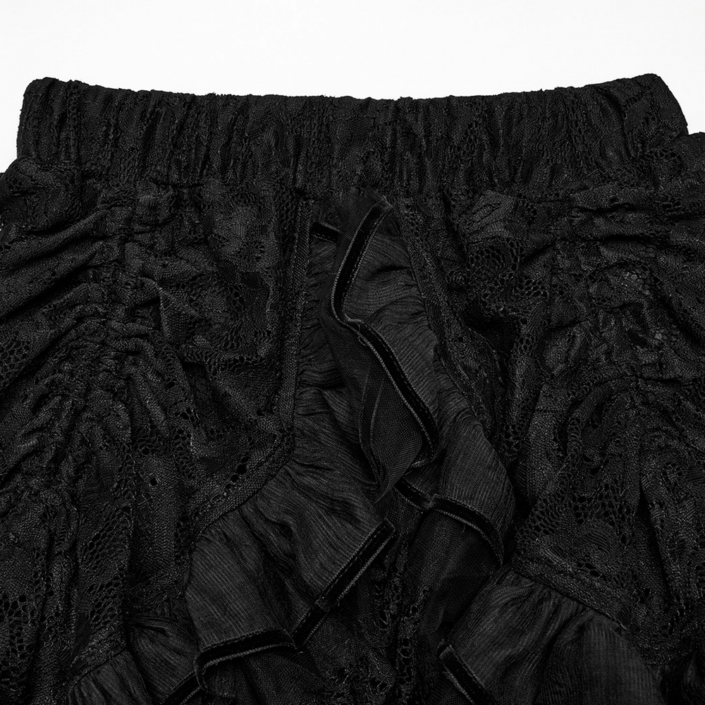 Close-up of a gothic lace skirt showcasing ruffled chiffon layers and structured lace for a high-low design.