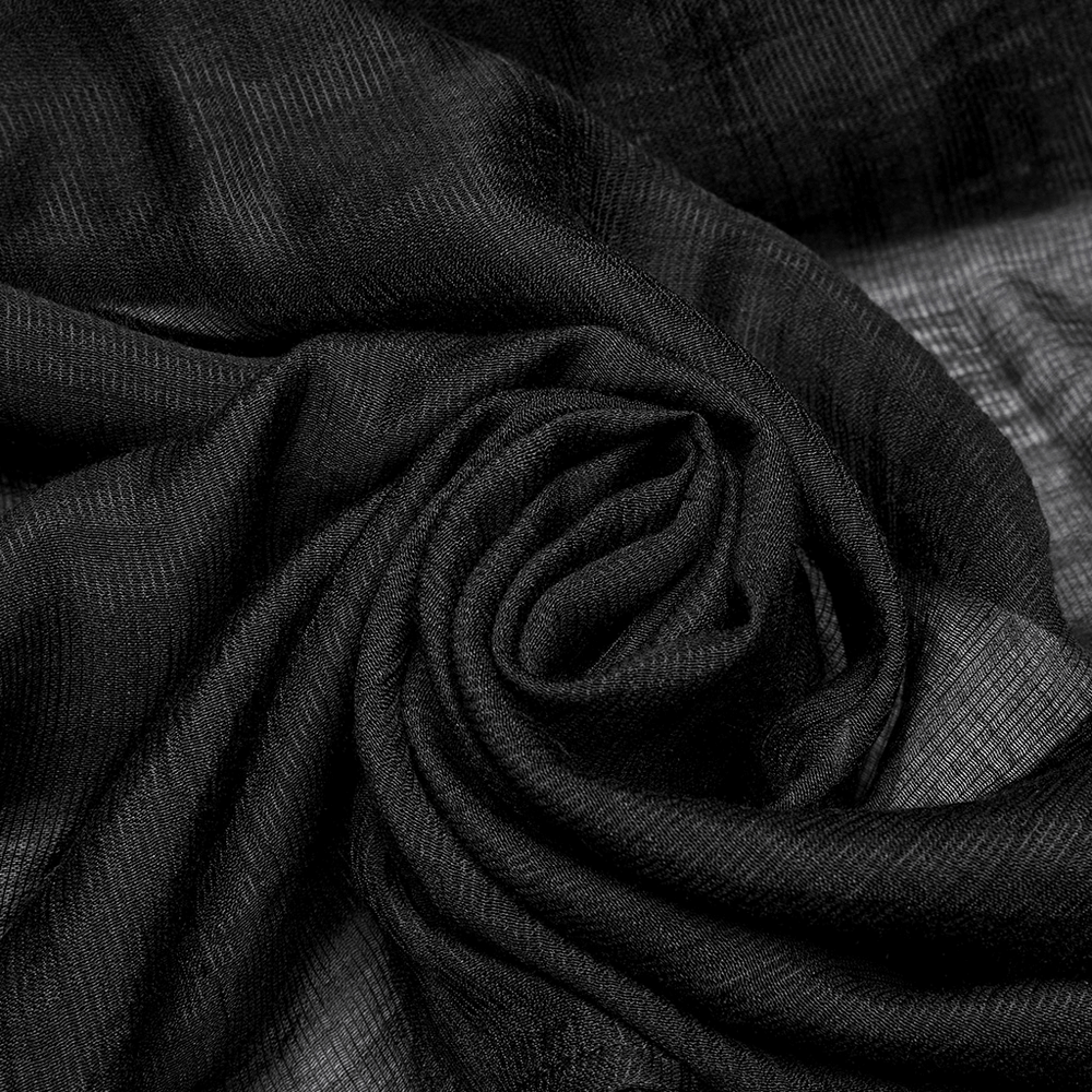 Close-up of soft black chiffon mesh fabric, ideal for gothic and alternative fashion designs.