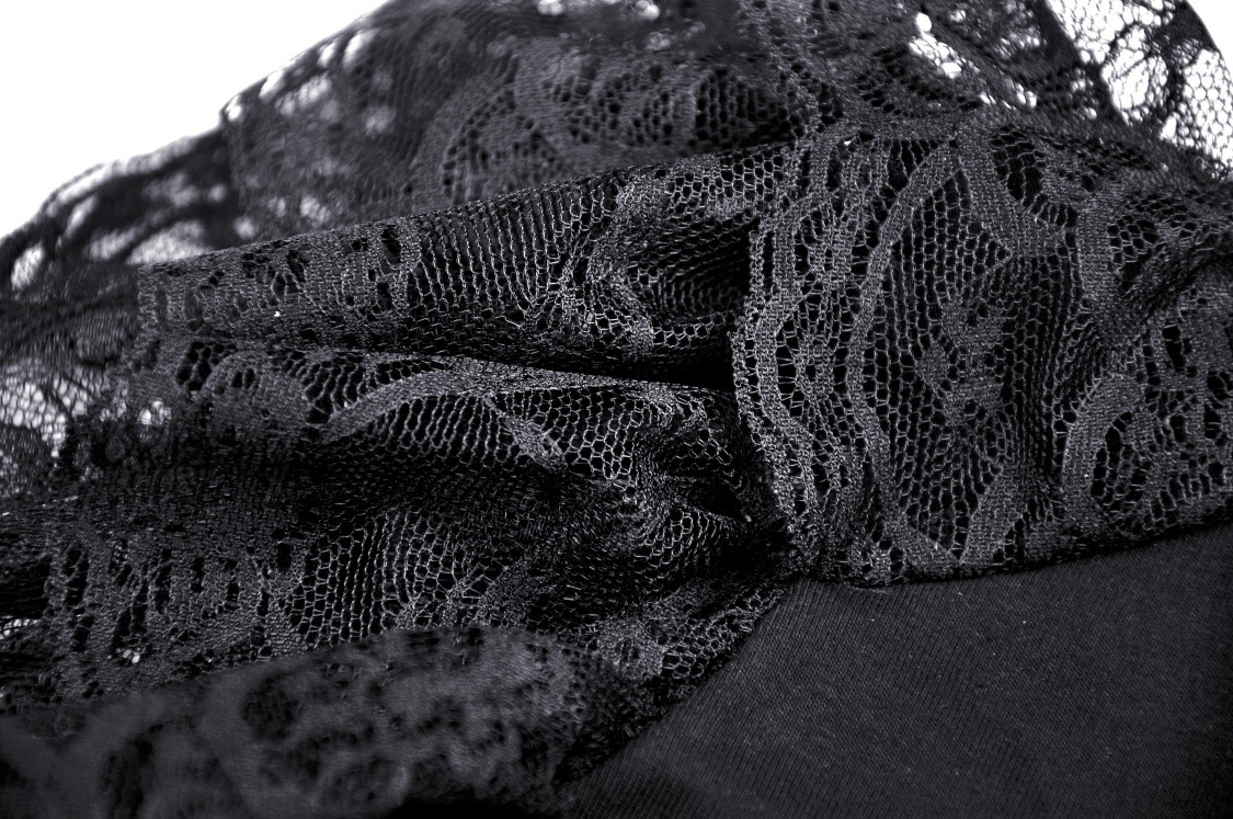 Close-up of intricate black lace fabric showcasing floral patterns, perfect for a gothic women's top.
