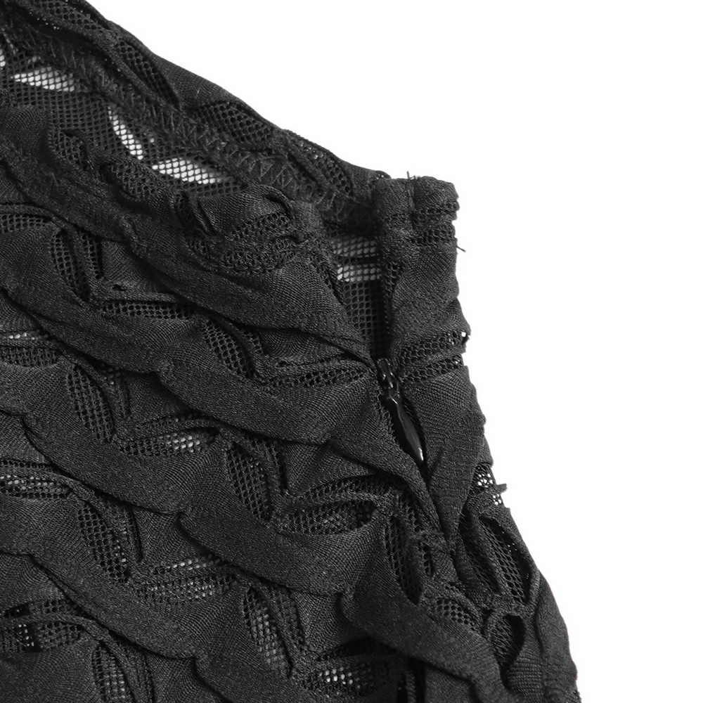 Close-up of intricate black lace detailing on gothic sheer top with stylish textured mesh design.