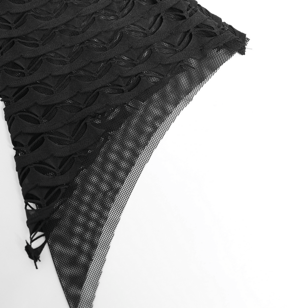Close-up of gothic lace sheer fabric showcasing intricate mesh design and layered effect.