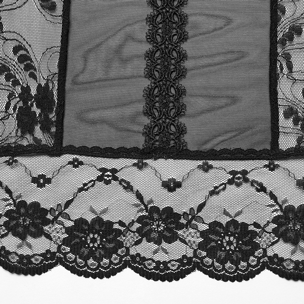 Close-up of black lace fabric with floral patterns, perfect for gothic fashion and elegant lingerie designs.