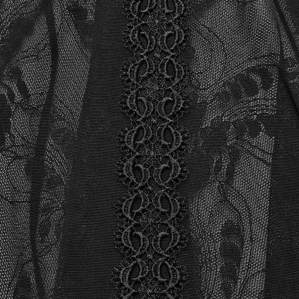 Close-up of black lace detailing on a gothic long skirt, featuring intricate patterns and a stylish drawstring accent.