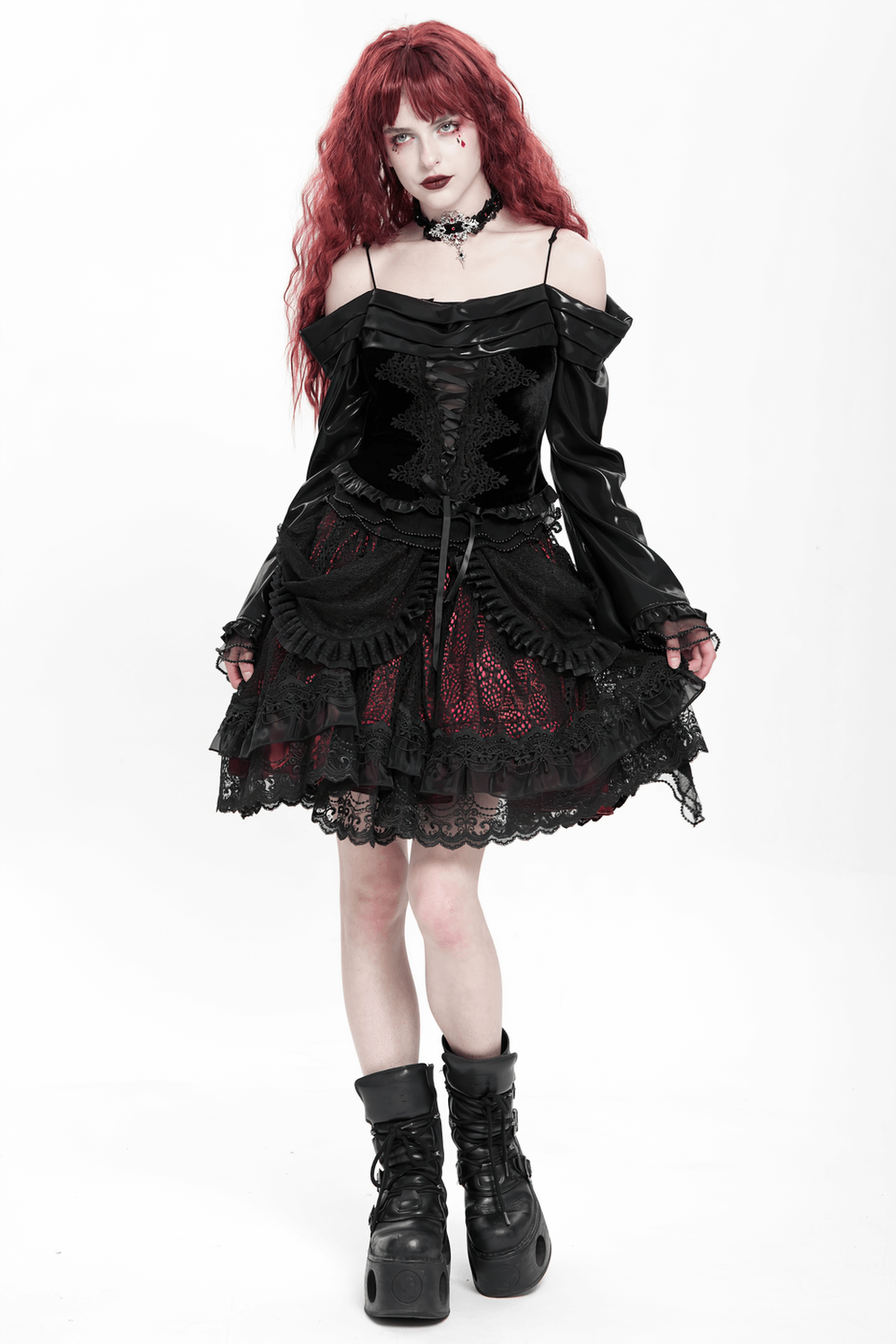 Gothic lace skirt with black ruffles and red underlayer, styled in Victorian fashion for alternative looks.