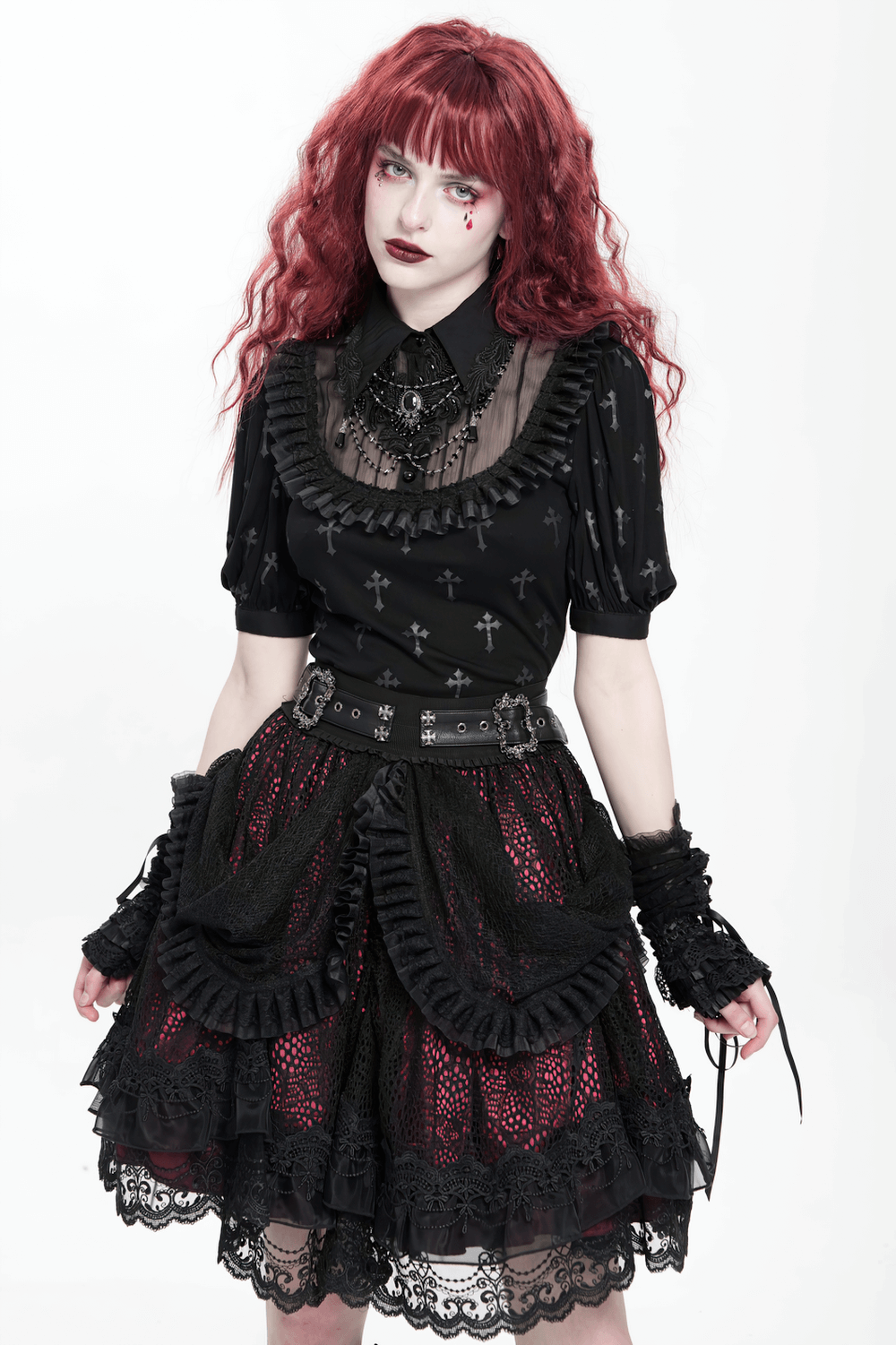 Gothic lace skirt with black ruffles and layered design, accessorized for a Victorian-inspired look in bold red and black.