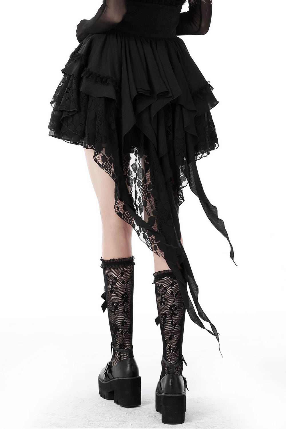Back view of gothic lace mini skirt with edgy corset detail and lace-over-knee socks for alternative fashion.