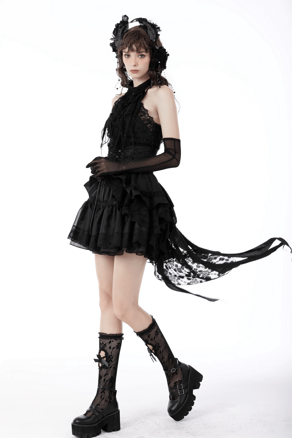 Gothic lace mini skirt with corset belt detail, styled with combat boots for an edgy alternative look.