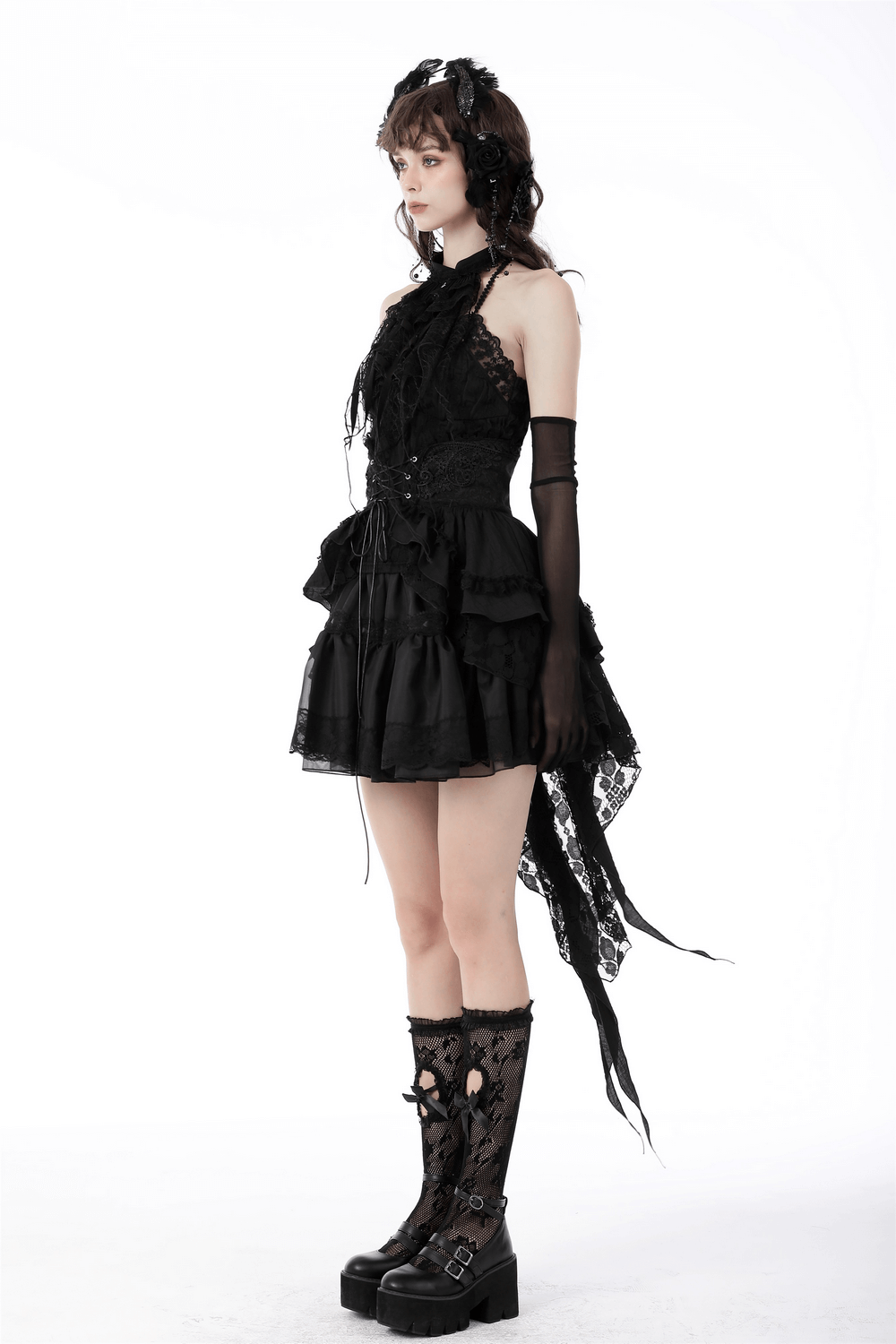 Gothic lace mini skirt with corset belt detail, styled with combat boots and gloves for an edgy alternative look.