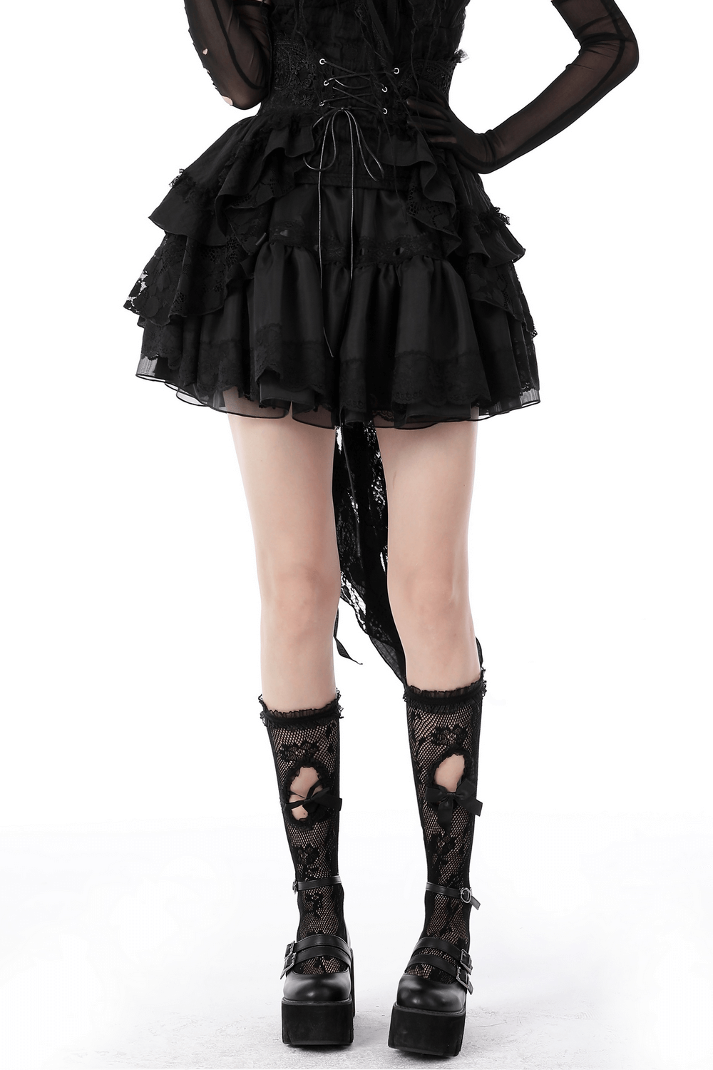 Gothic lace mini skirt with an edgy corset belt, paired with lace knee-high socks and platform boots.