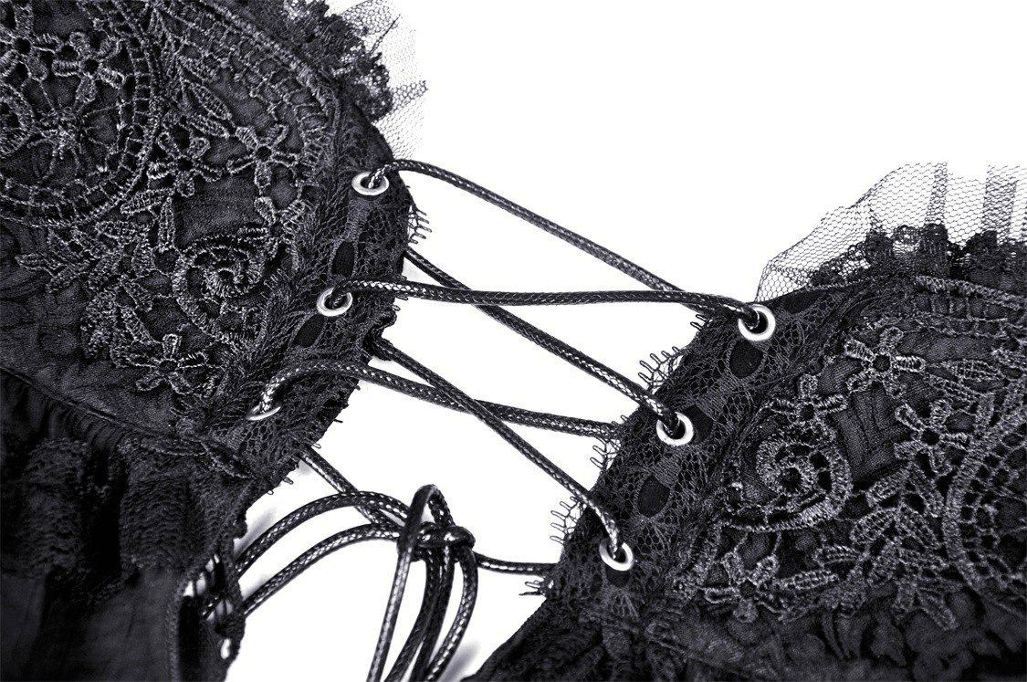 Close-up of gothic black lace with intricate detailing and edgy corset lacing, perfect for alternative fashion.