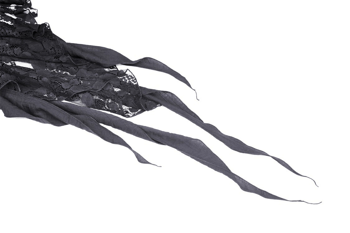Close-up of black lace and flowing ribbons from a gothic lace skirt with edgy details.