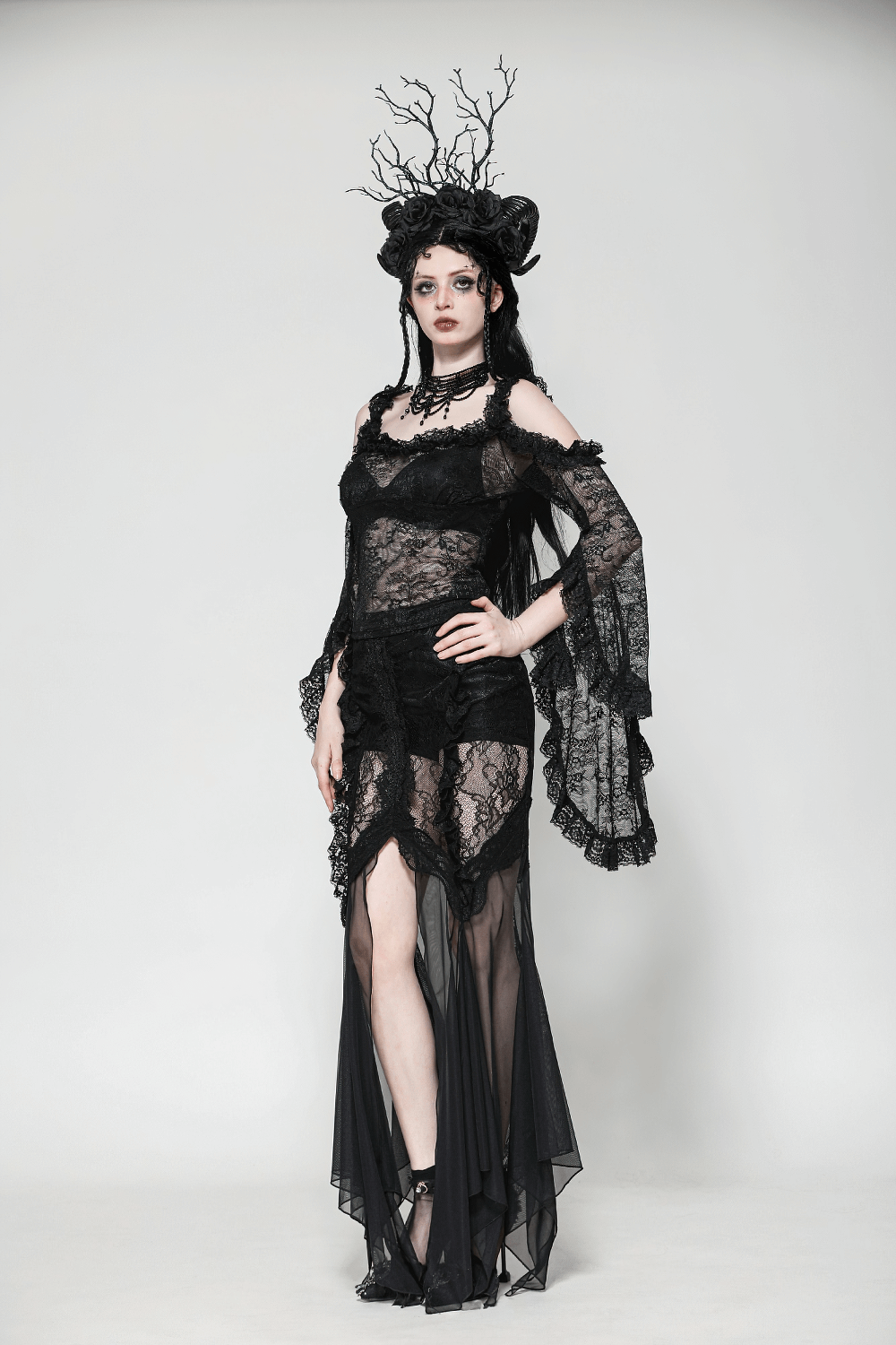 Gothic lace skirt with sheer mesh, high-low hem, and dark Victorian elegance perfect for alternative fashion.