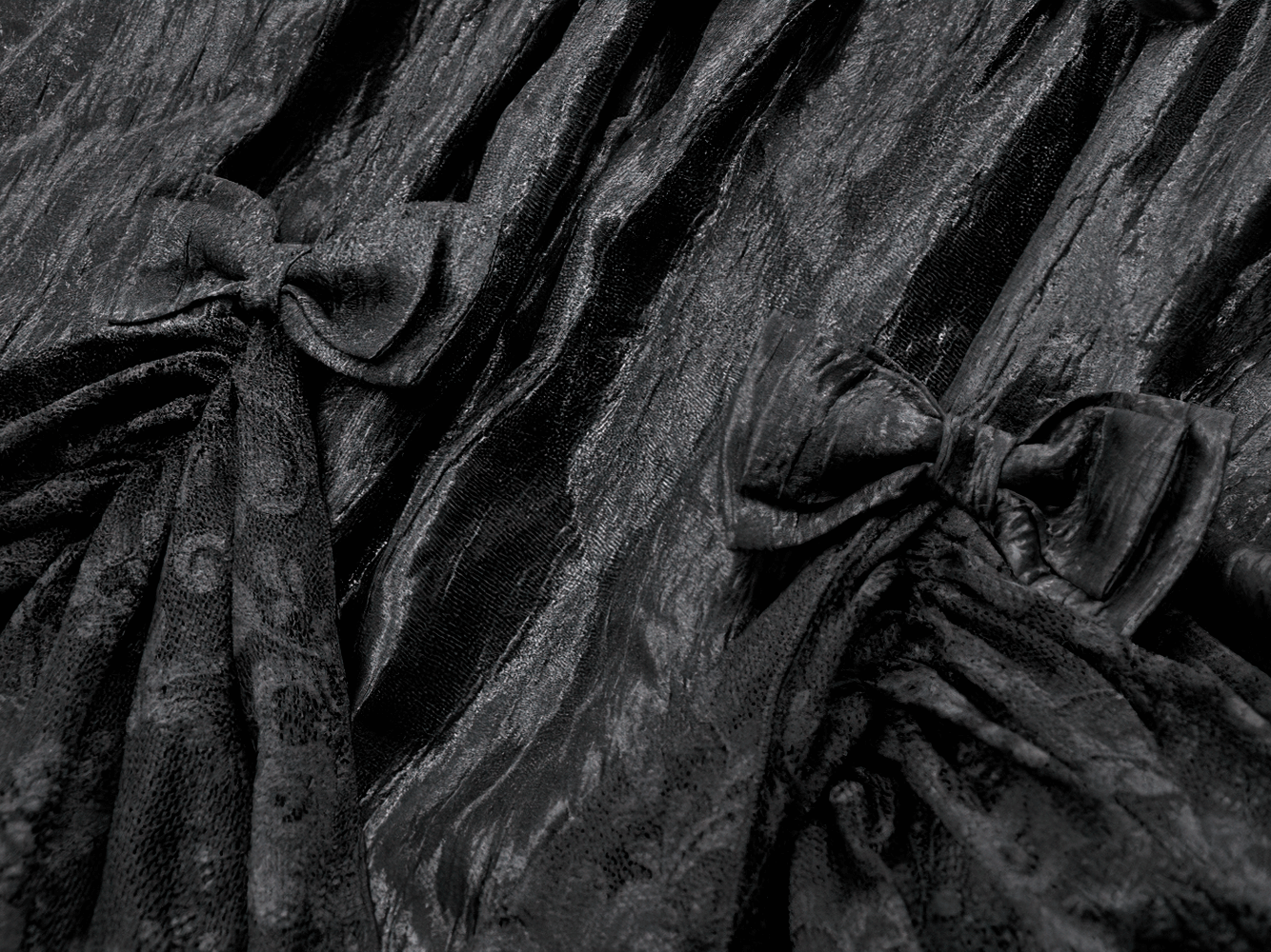 Gothic Lace Strap Dress with Ruffled Detailing and Lace Trim showcasing intricate black fabric with bows and ruffled design.