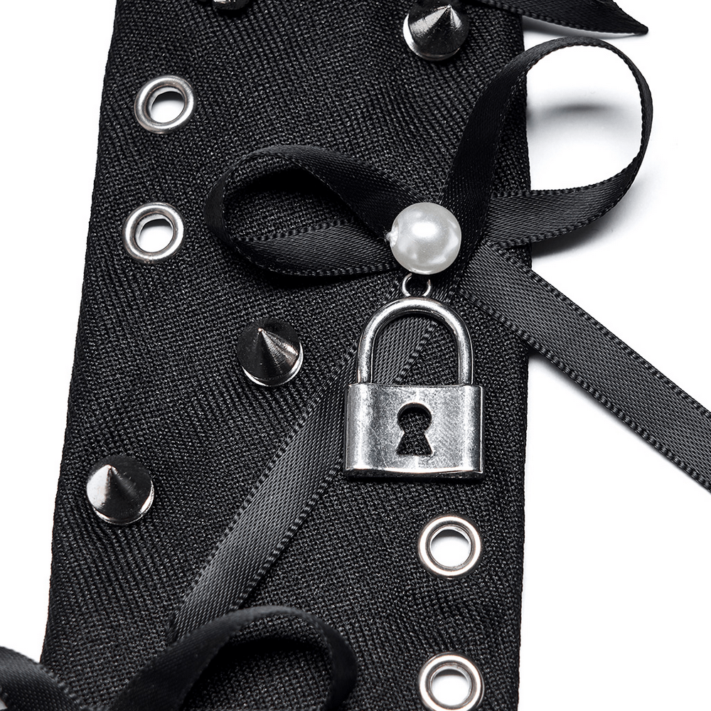 Gothic lace tie featuring metal lock charm, black ribbons, and spikes for a punk chic accessory.