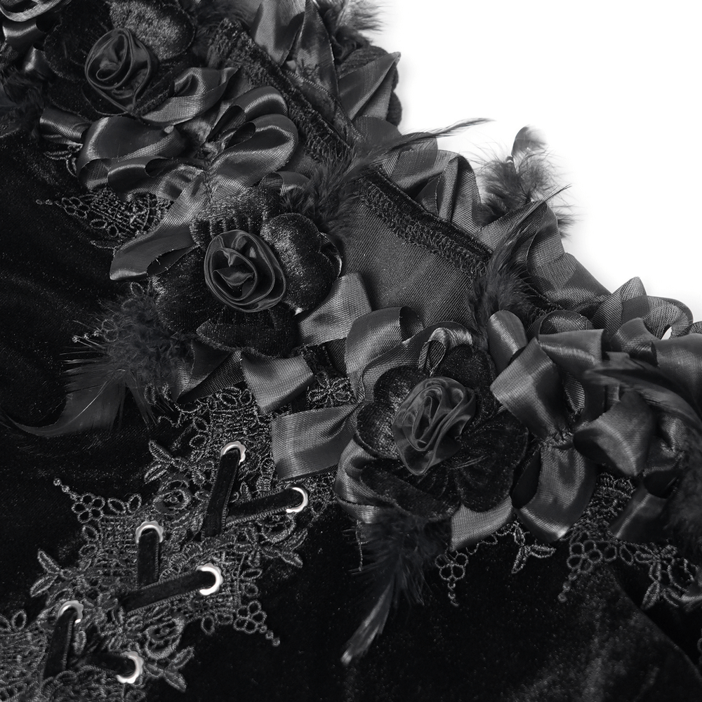 Close-up of floral lace and ribbons on a gothic velvet blouse, showcasing its Victorian-inspired design.