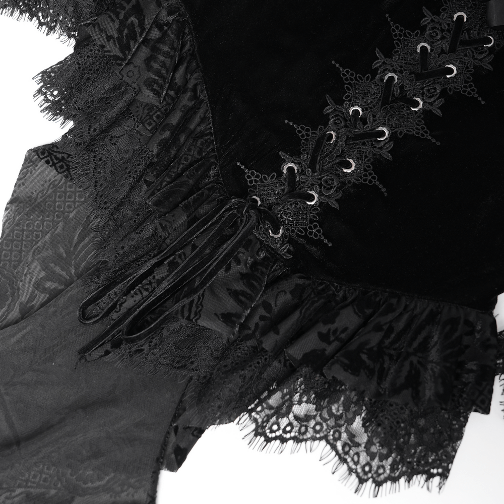 Gothic velvet blouse with lace trim, lace-up front, and frilly hem, showcasing elegant Victorian floral details.