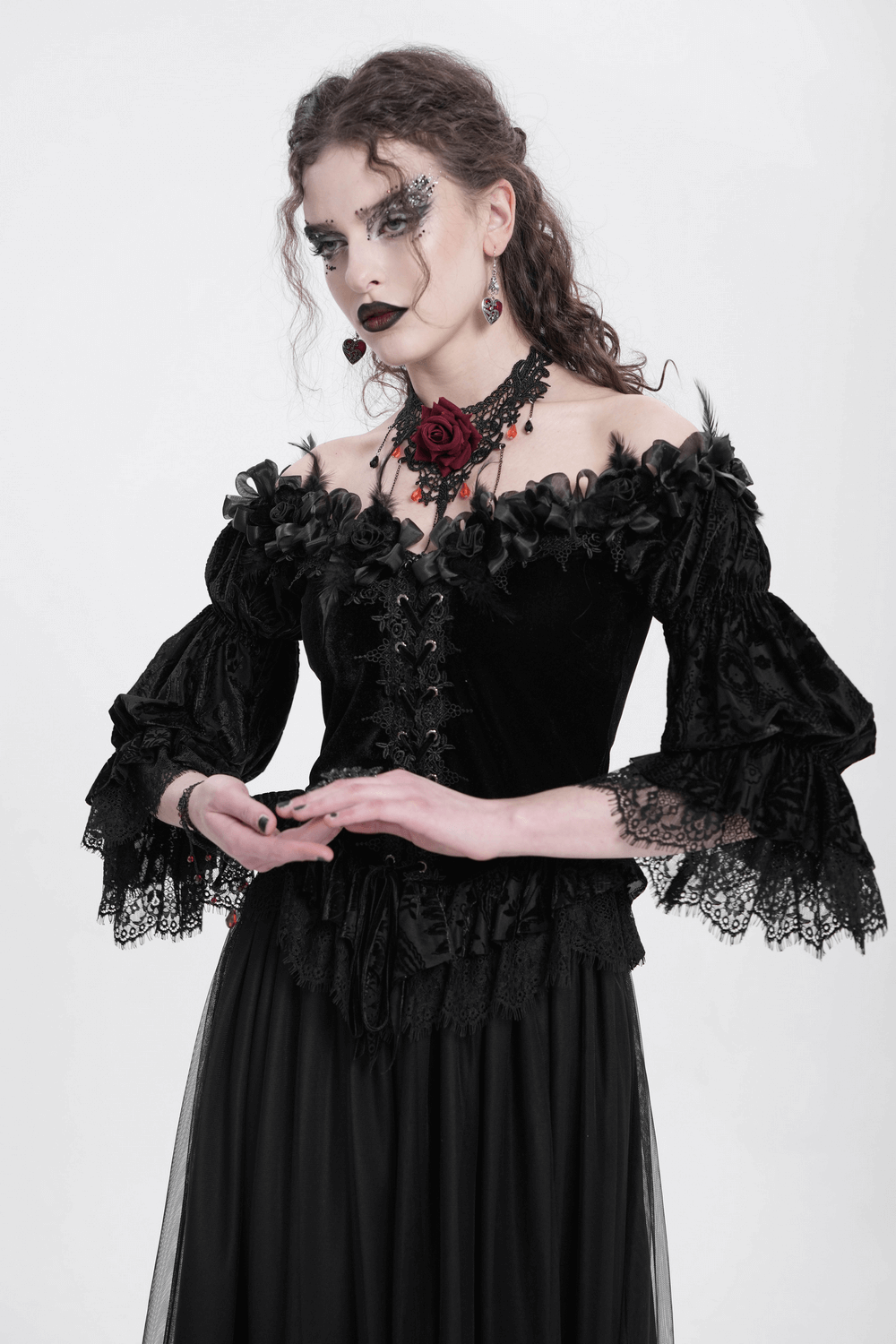 Gothic lace-trimmed velvet off-shoulder blouse with roses, perfect for Victorian-inspired outfits.