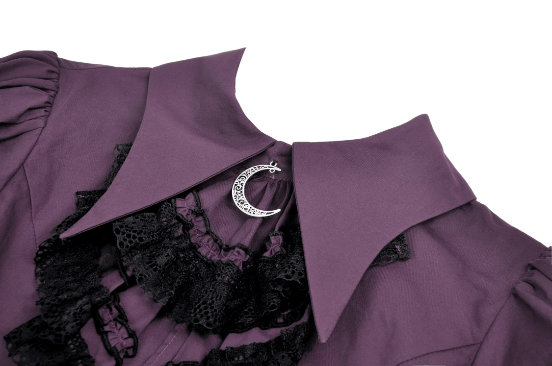 Close-up of Gothic lace-trimmed blouse with crescent moon pendant and dramatic ruffles in dark purple fabric.