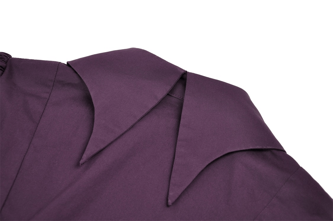 Close-up of gothic blouse collar in rich dark purple fabric with elegant pointed design.