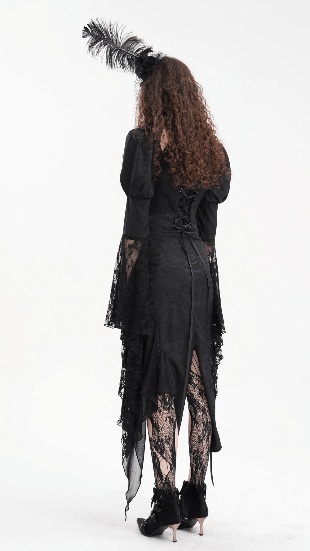 Back view of a gothic lace-up dress with asymmetrical hem and dramatic flared sleeves, showcasing dark elegance.