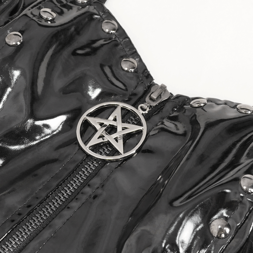 Close-up of a gothic dress zipper featuring a pentagram charm and glossy black fabric with studs.