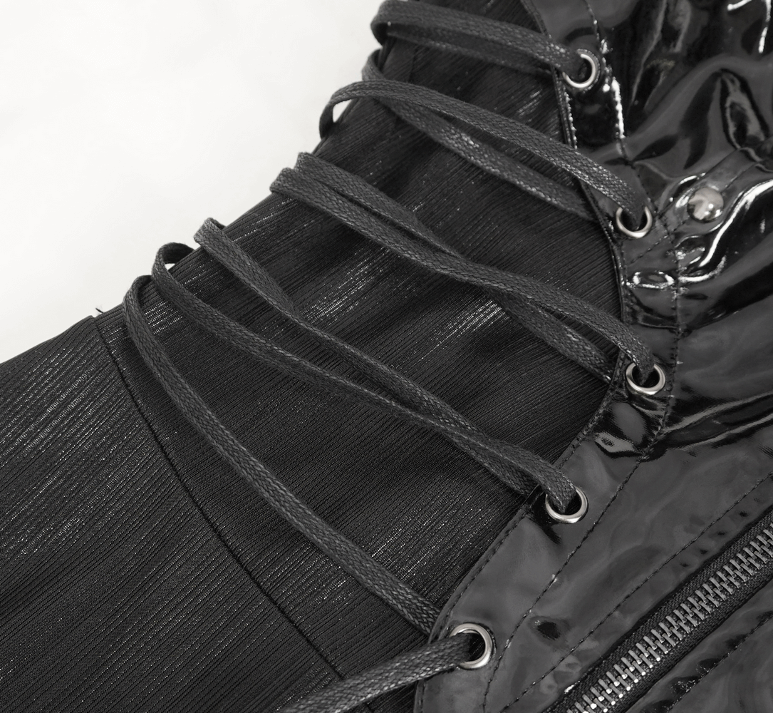 Close-up of gothic lace-up detailing on a black corset dress with shiny texture and adjustable straps.