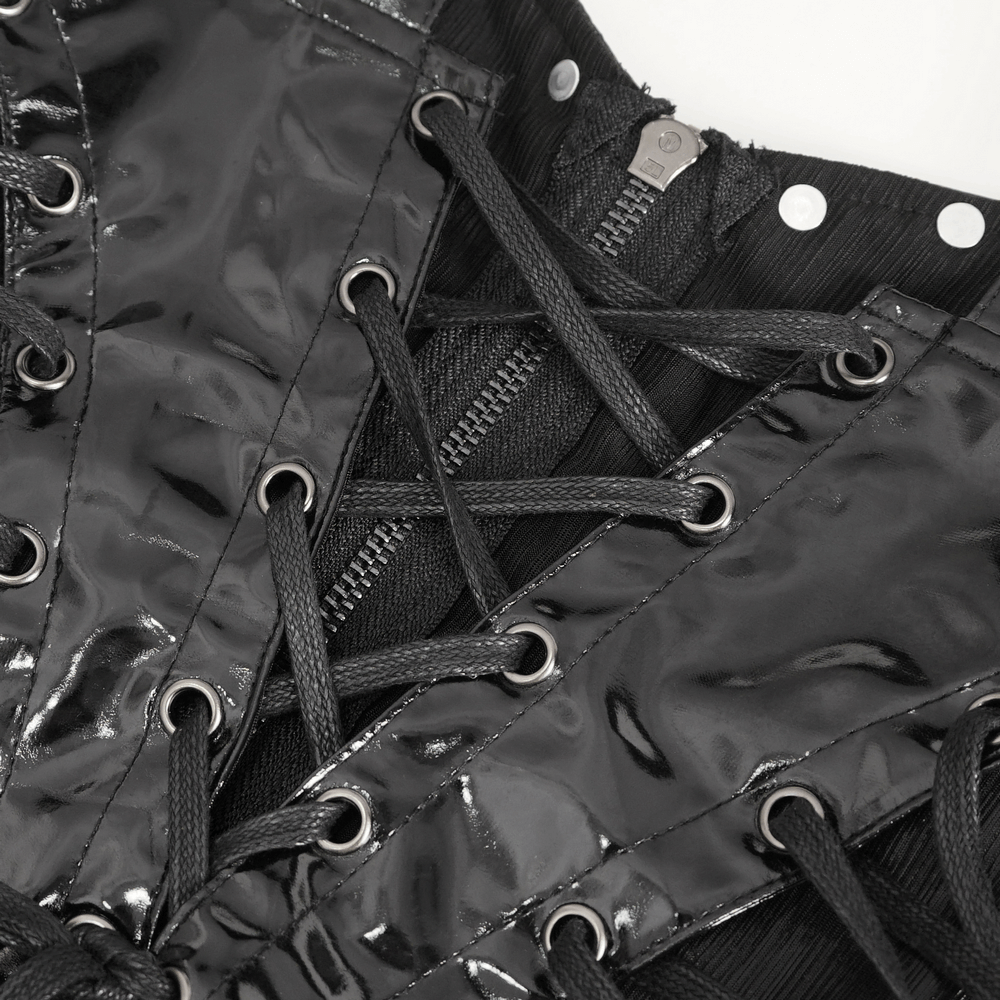 Close-up of gothic dress corset detailing with black lace-up design and zipper accents.