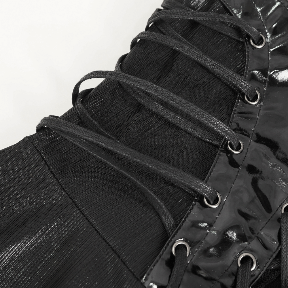 Close-up of black lace-up detailing on a gothic dress showcasing elegant corset design.