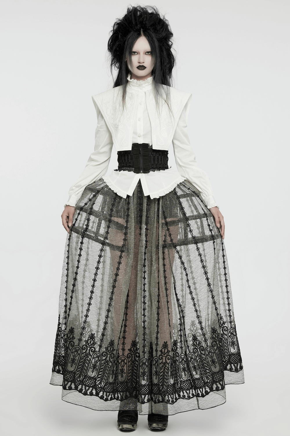 Victorian women's gothic look featuring a lace corset belt with rivet details and an elegant black layered skirt.