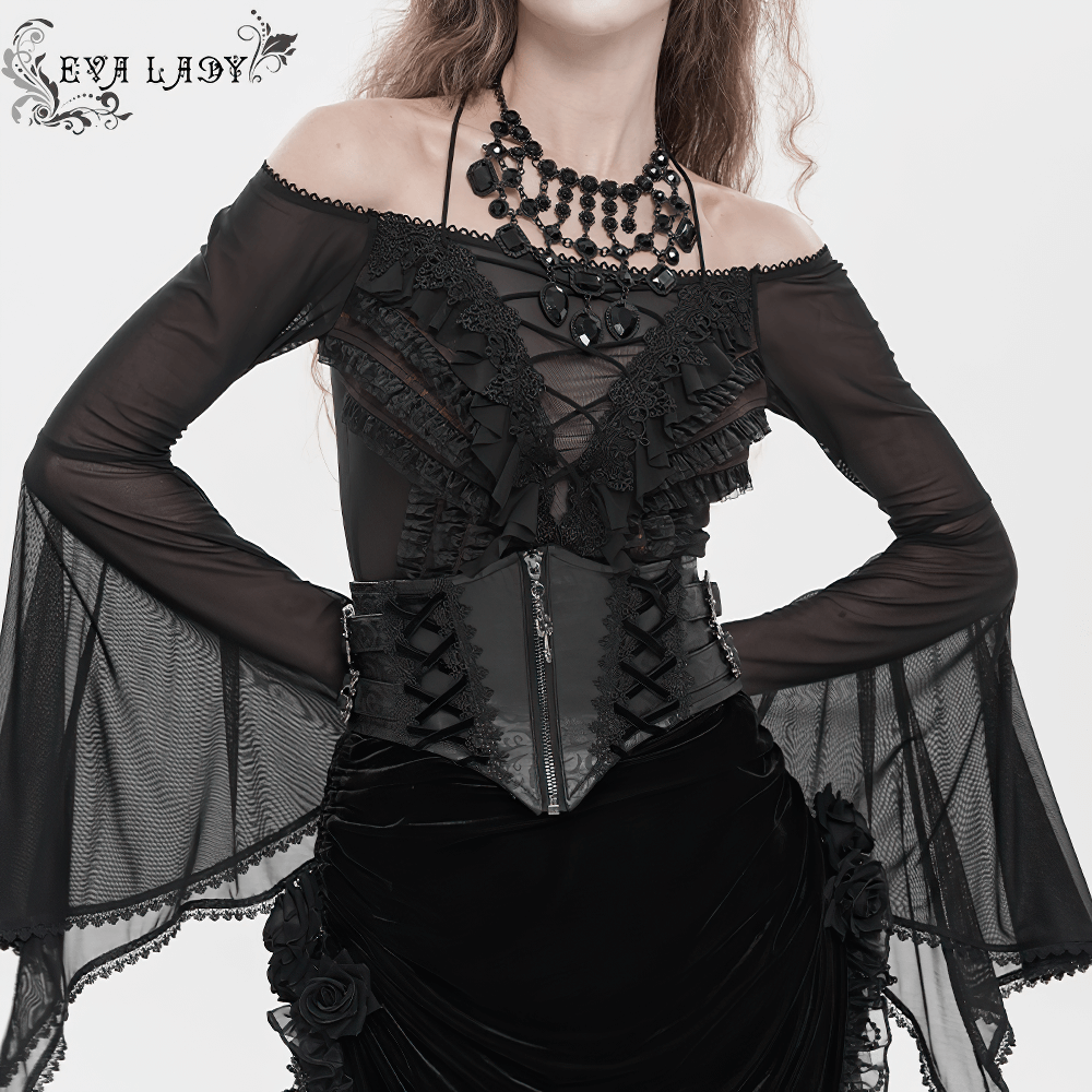 Gothic Lace-Up Black Corset Waist Belt with Cross Details worn with a sheer black top and dramatic sleeves.