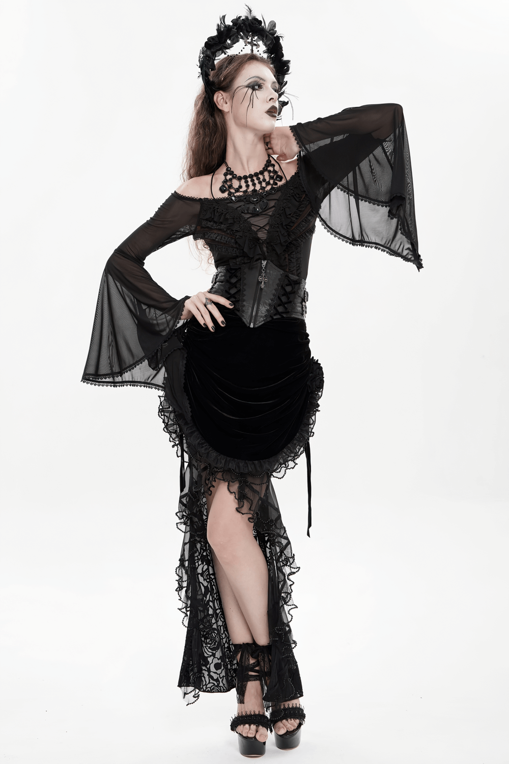 Gothic Lace-Up Black Corset Waist Belt with Cross Details worn by a model in a dark, elegant outfit.