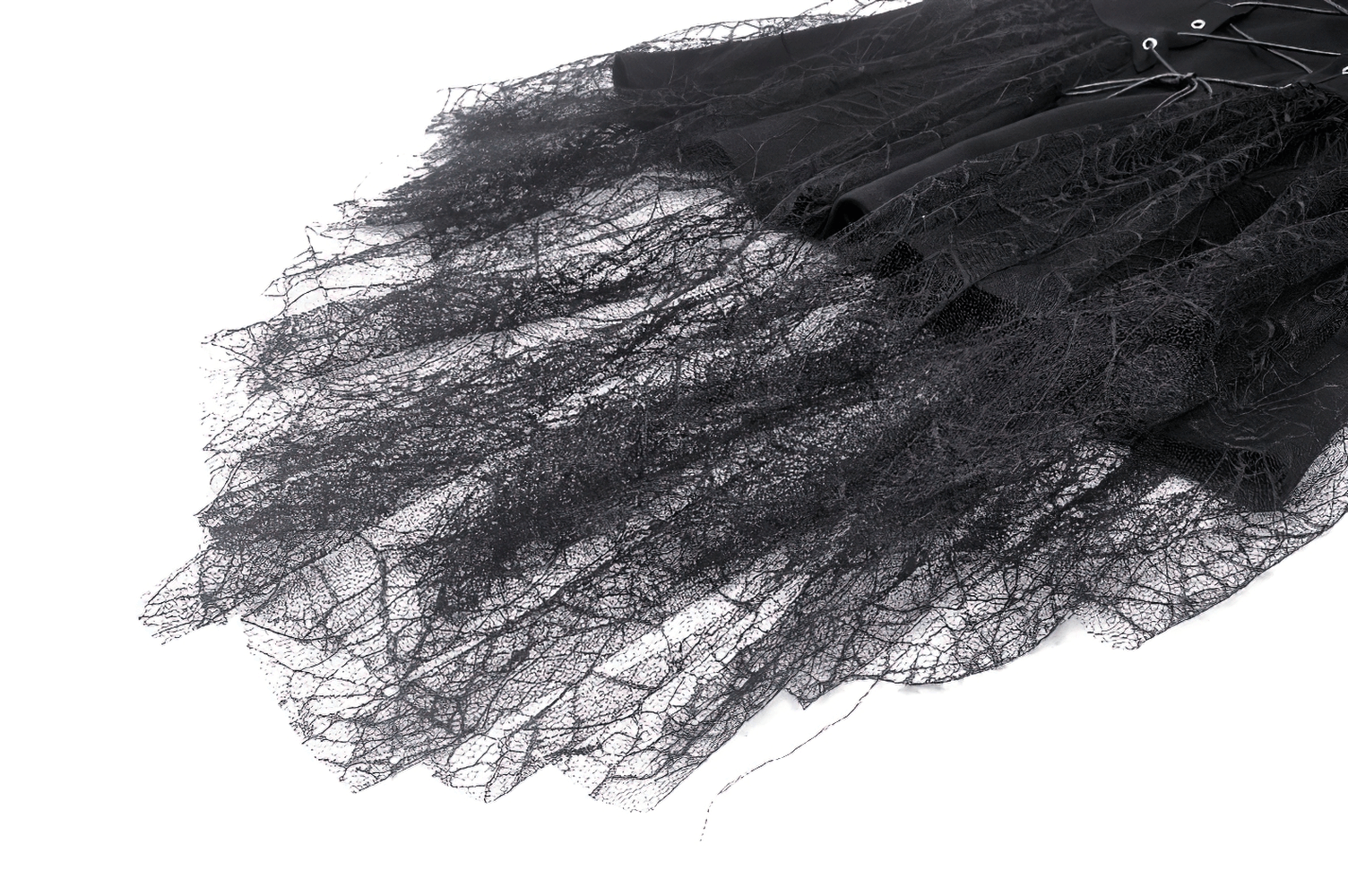Close-up of gothic black dress skirt featuring spider web lace details and lace-up design.
