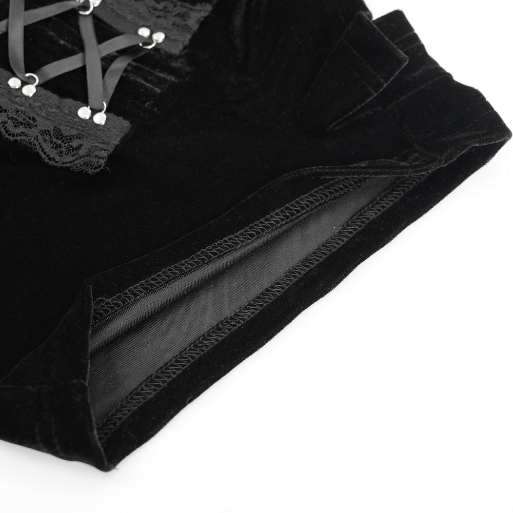 Close-up of gothic lace-up black ruffled shorts showcasing intricate lace and tie details for edgy fashion.