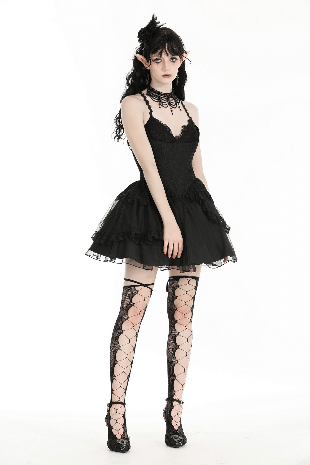Gothic lace-up black tulle dress featuring a corset bodice, voluminous skirt, and elegant accessories for dramatic flair.