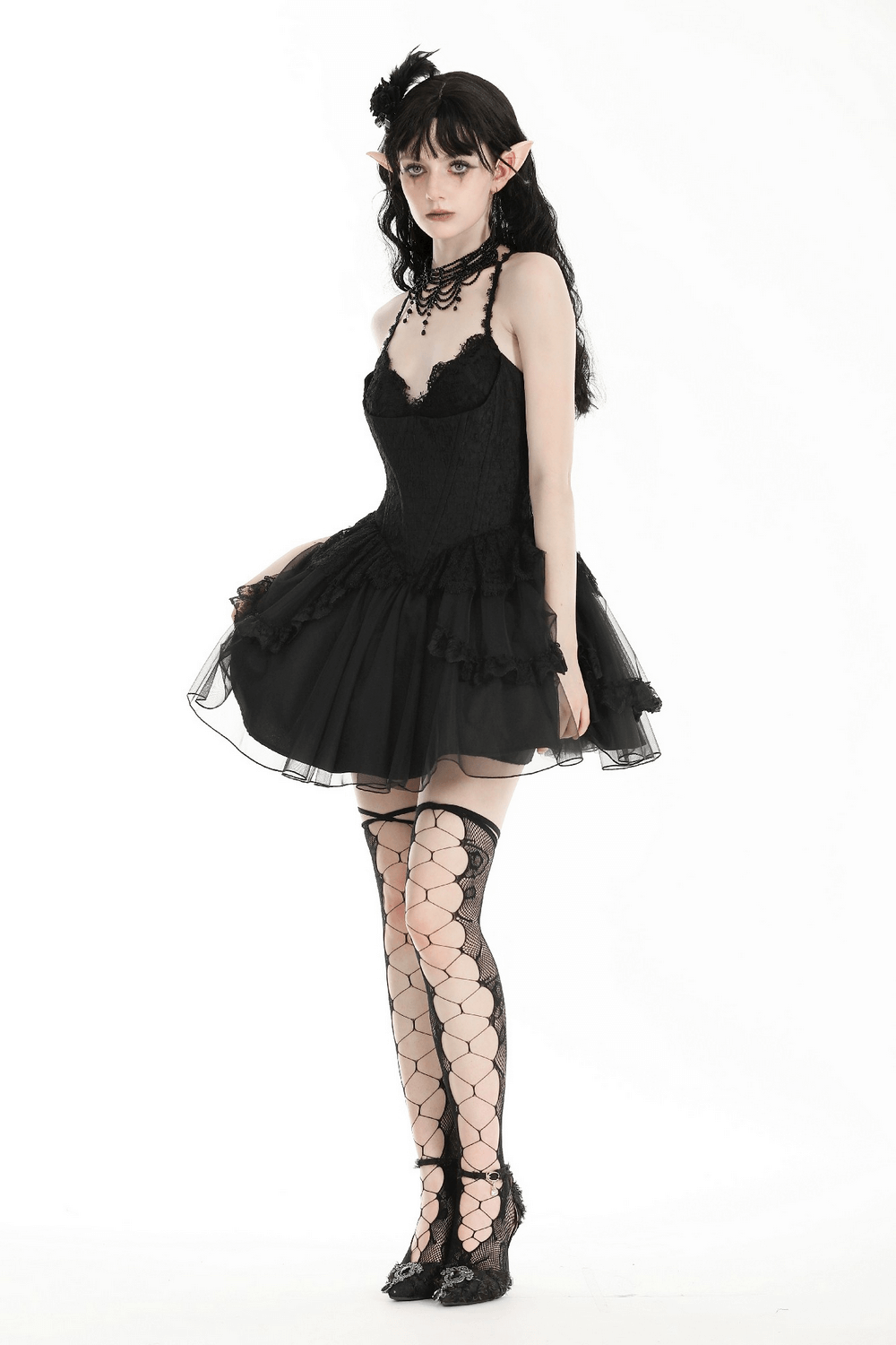 Gothic lace-up black tulle dress with elegant layers and mesh stockings, perfect for themed events and evening wear.
