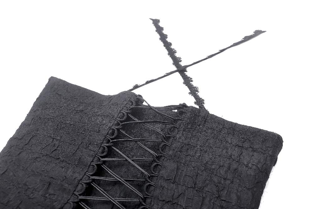 Close-up of the lace-up black corset bodice with intricate detailing for gothic style dress.