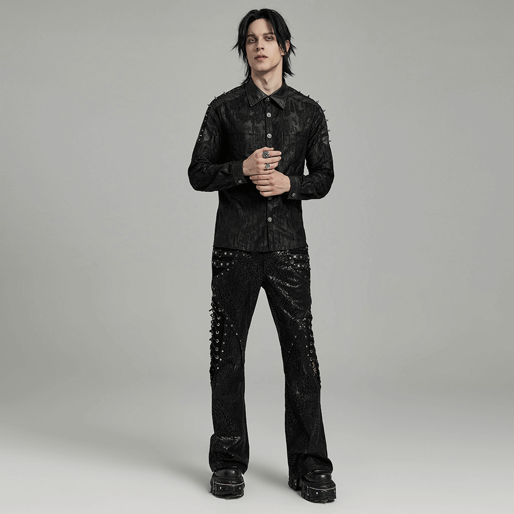 Men's gothic lace-up black flare pants with rivet mesh detailing, paired with a matching stylish black jacket.