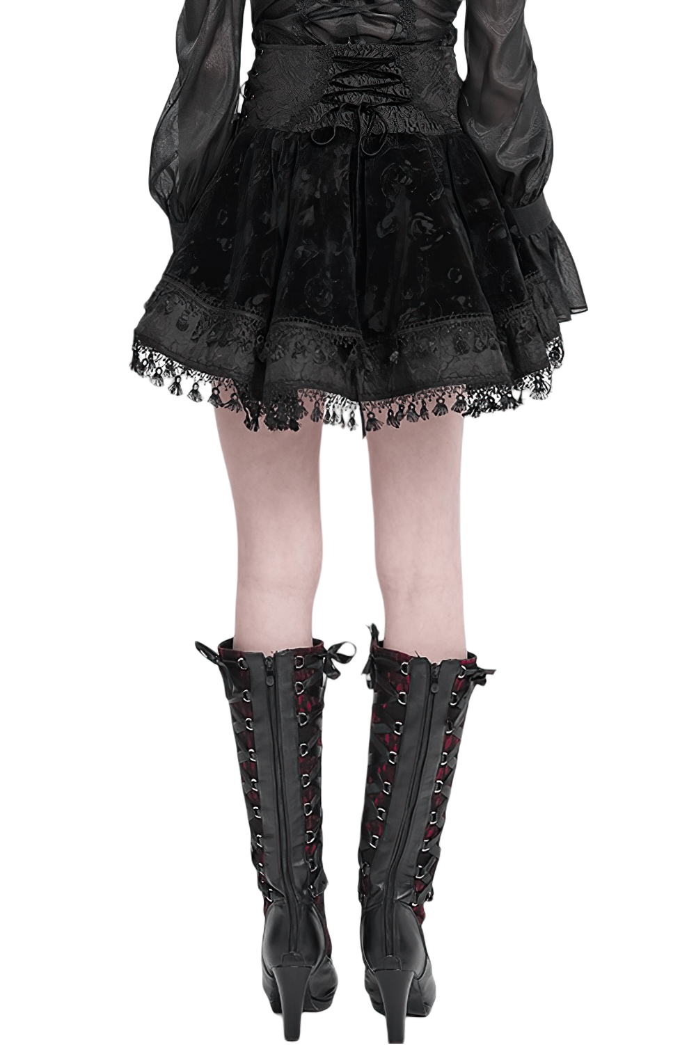 Back view of Gothic lace-up black velvet skirt with tassel hem and intricate lace trim.