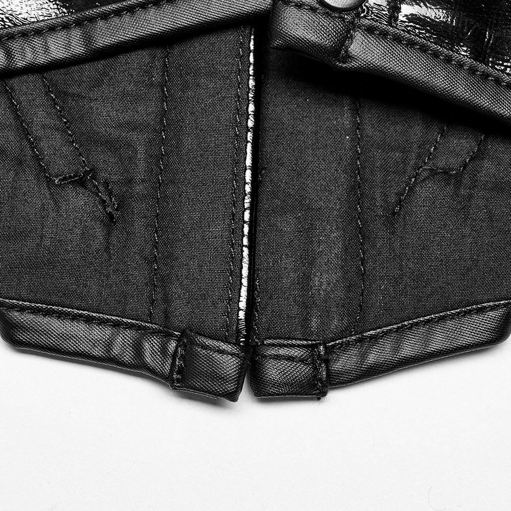 Close-up of gothic lace-up cincher detailing with black fabric and silver accents for dark elegance.