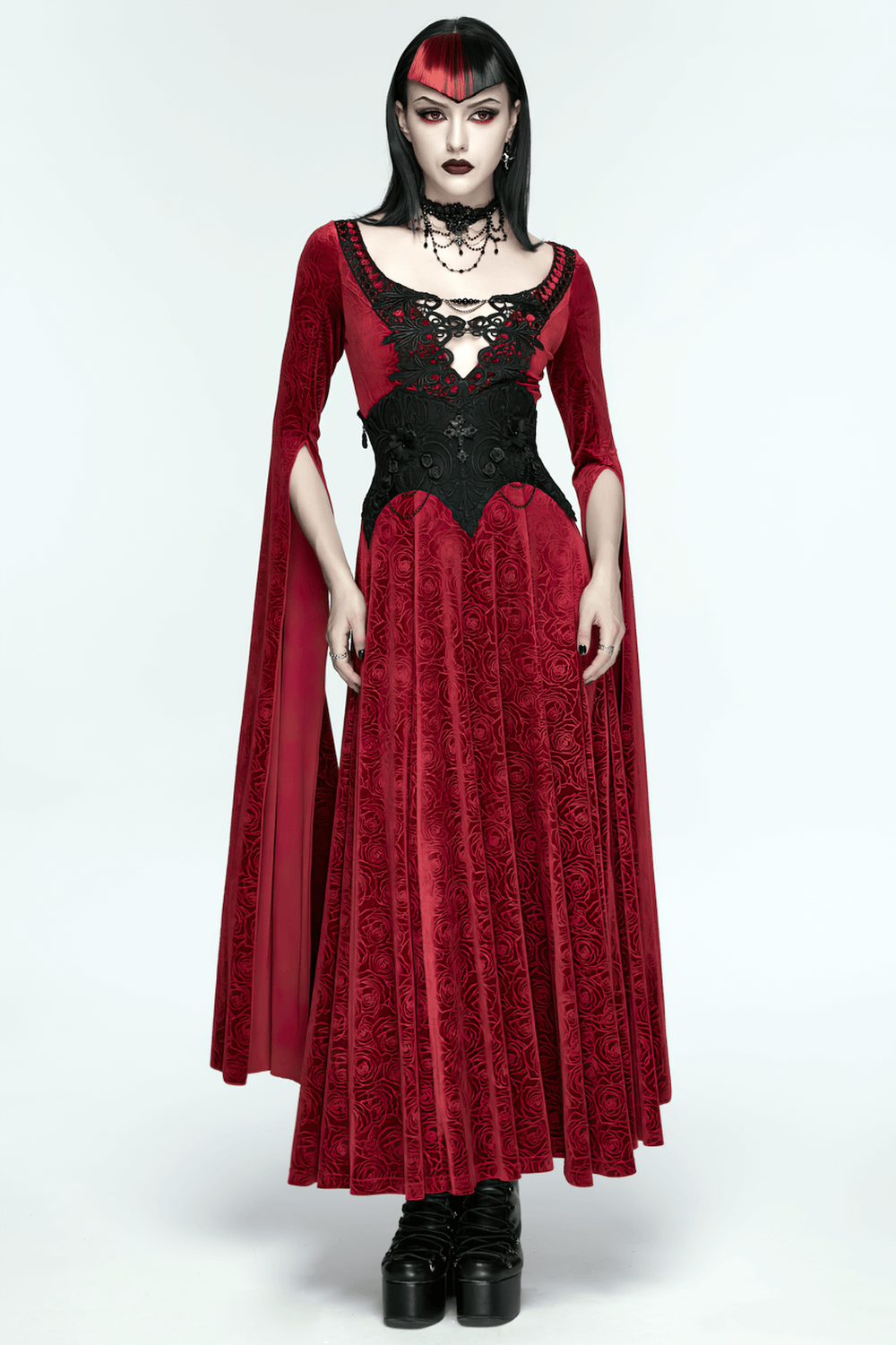 Gothic Lace-Up Corset Belt with Embroidery and Cross Details showcased with a striking red velvet gown featuring long sleeves and intricate patterns.