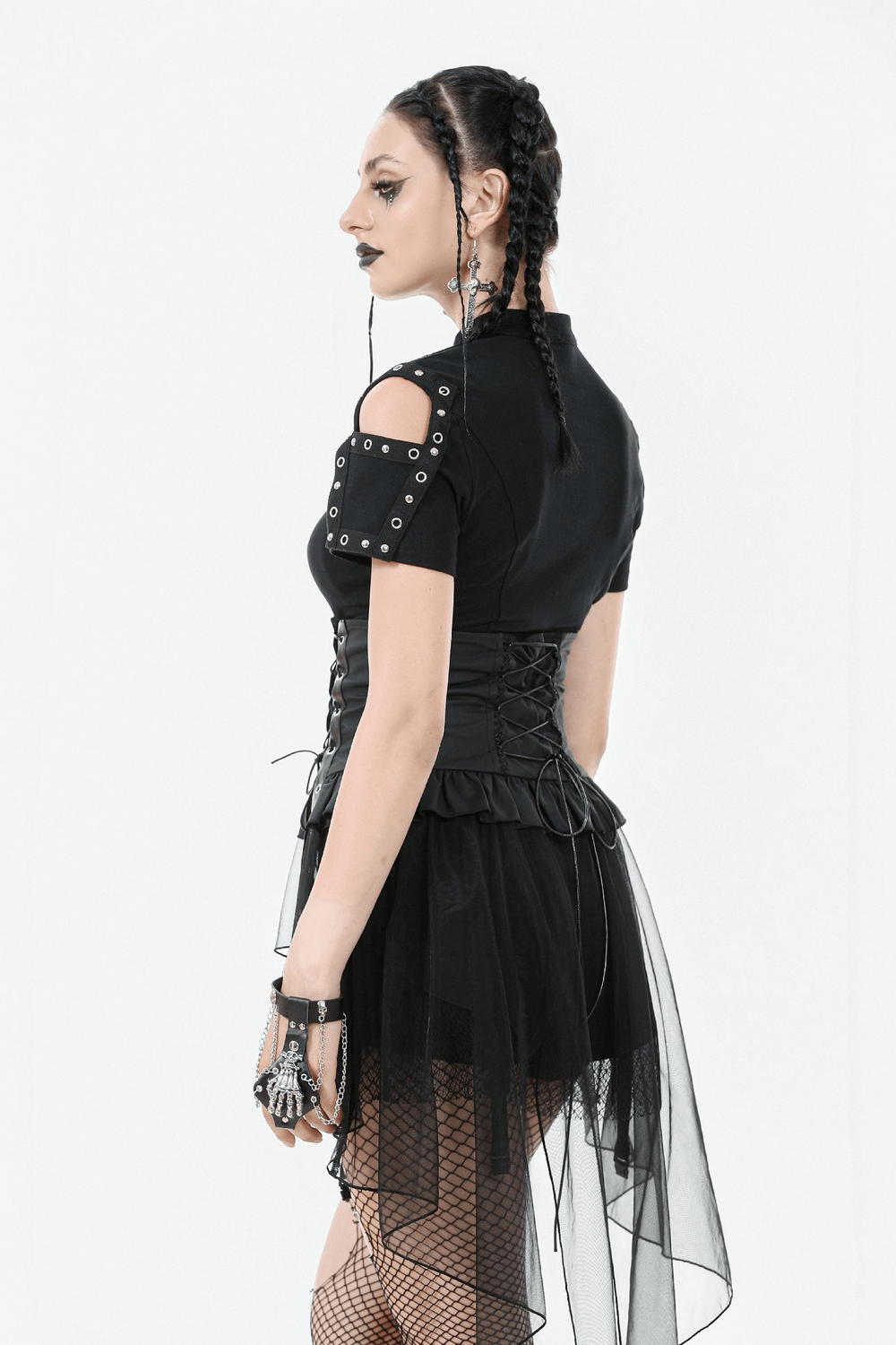Gothic lace-up corset belt with layered tulle skirt worn by model, showcasing edgy fashion and dramatic style.