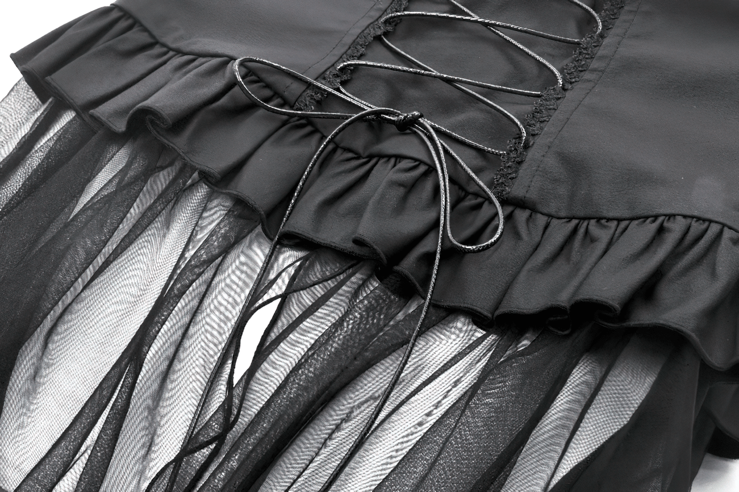 Close-up of gothic corset belt with lace-up back and flowing layered tulle skirt for a dramatic, edgy look.