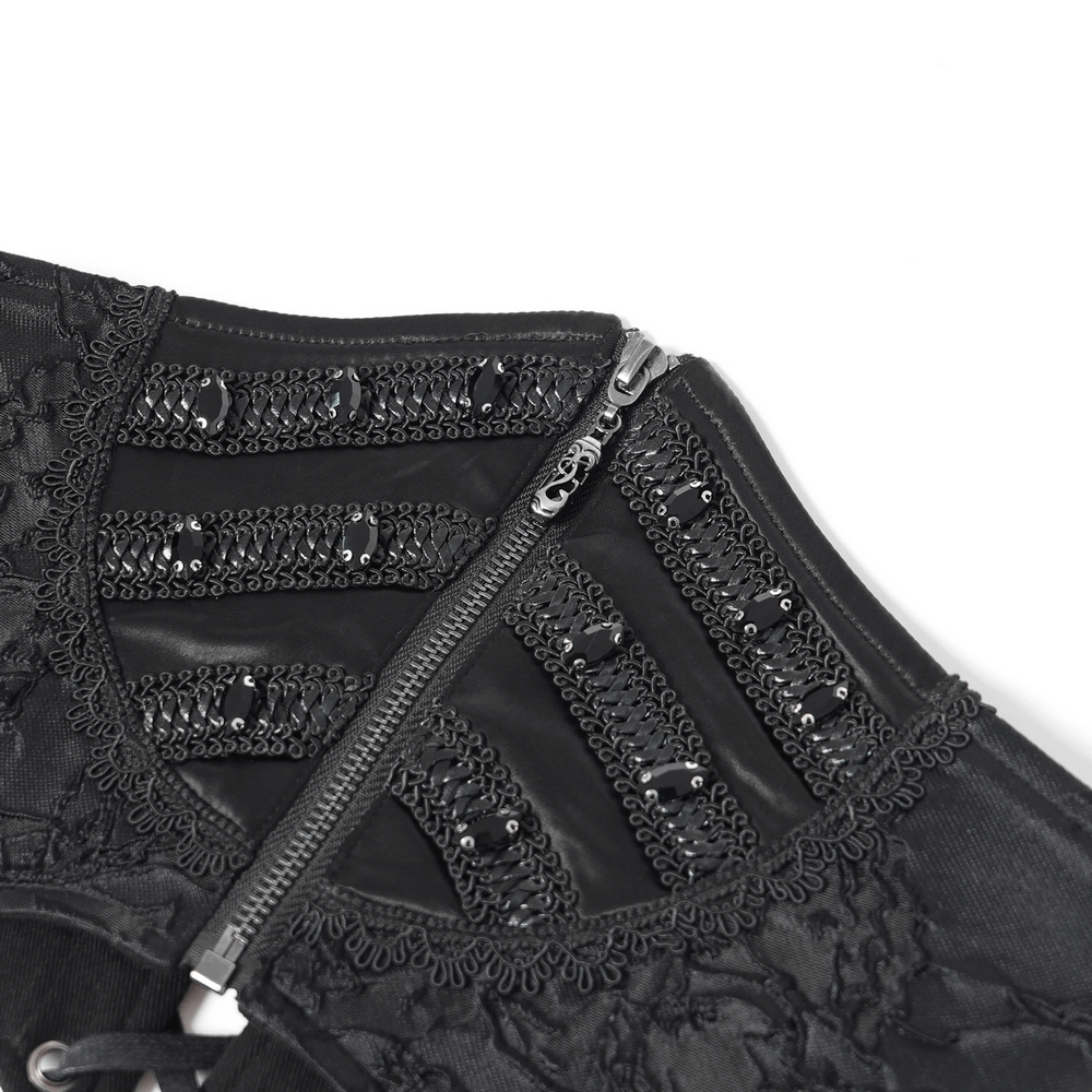 Intricate black lace-up corset belt with zip detail and bead embellishments for a gothic look.