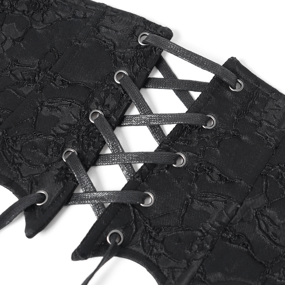 Close-up of gothic lace-up corset belt featuring intricate black lace and eyelet detailing.