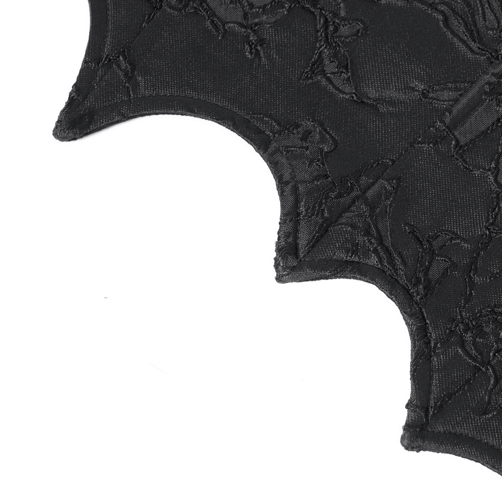 Intricate black fabric detail of gothic lace-up corset belt with textured design, perfect for edgy fashion.